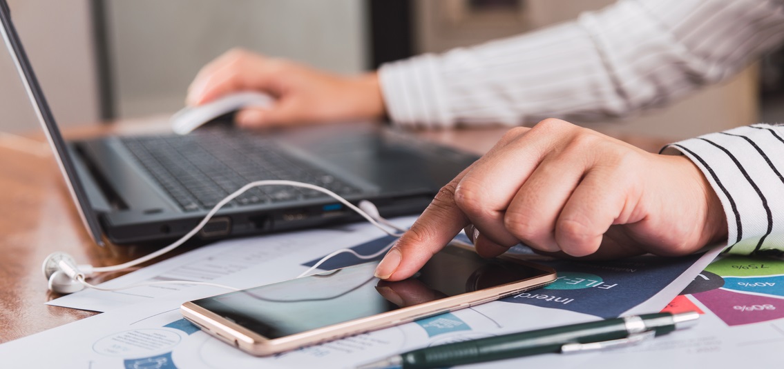 photo of hands using a laptop