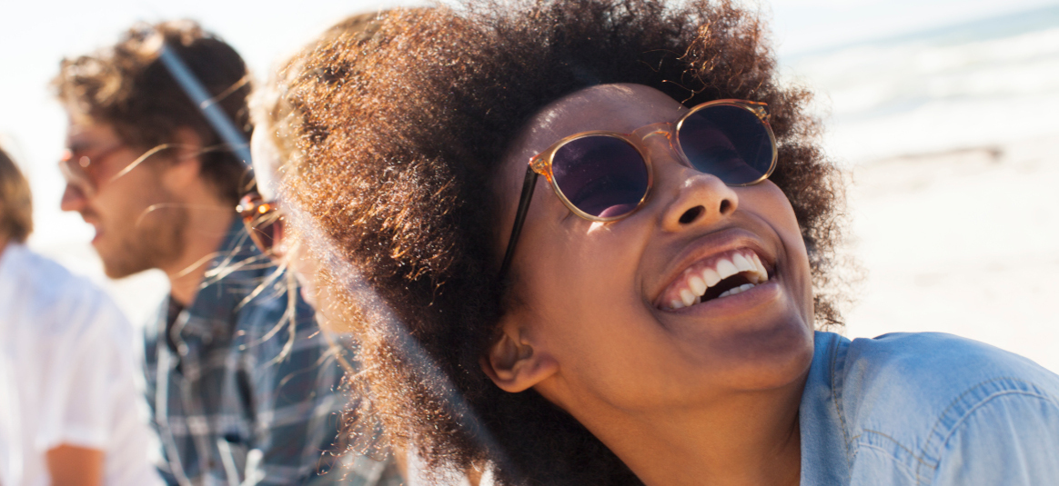 Photo of a smiling woman with sunglasses