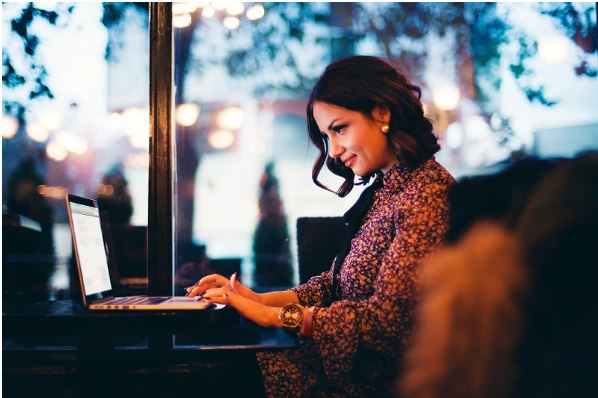 Photo of lady working at a laptop