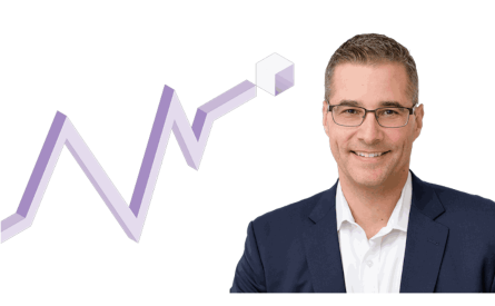 Photo of a smiling businessman next to a 3D chart