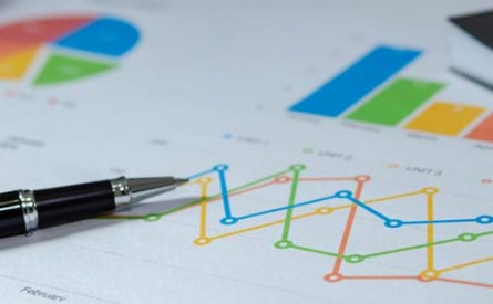 Photo of a data visualisation on paper with a pen