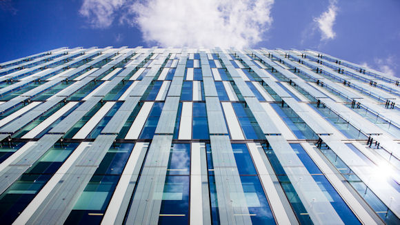 Photo looking up at office building wall